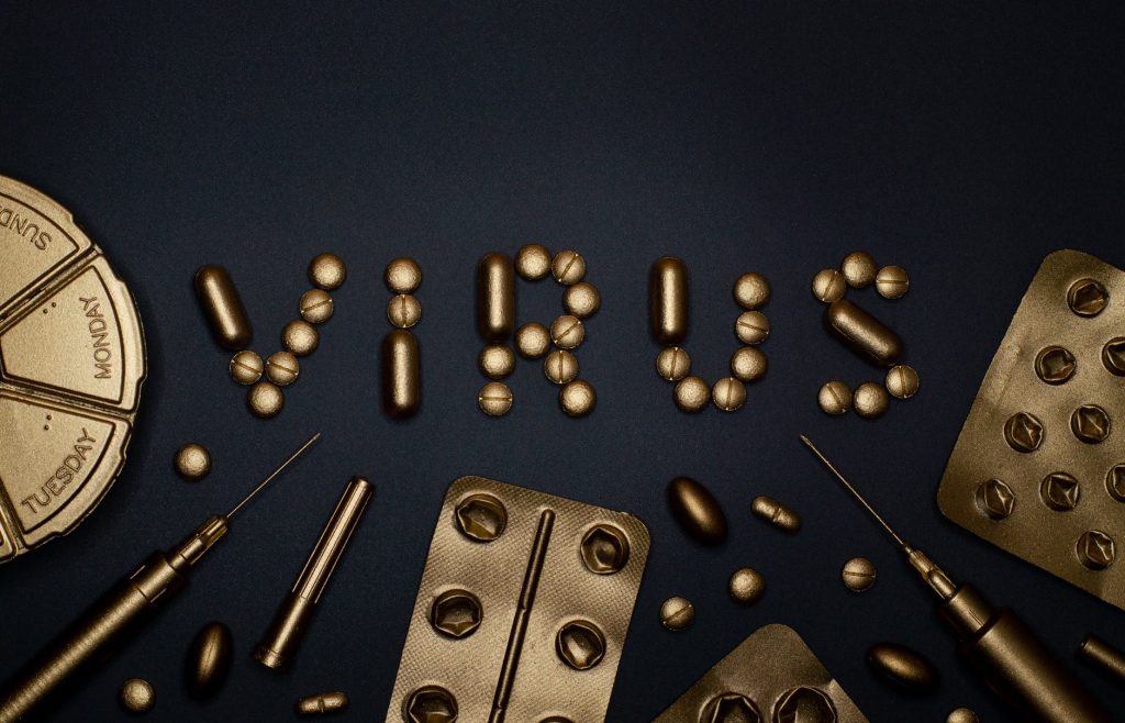 syringe and pills on blue background